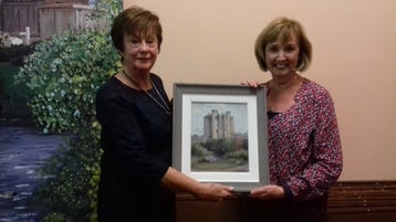 Captain Kitty Ross presents her prize to Miriam Moyles